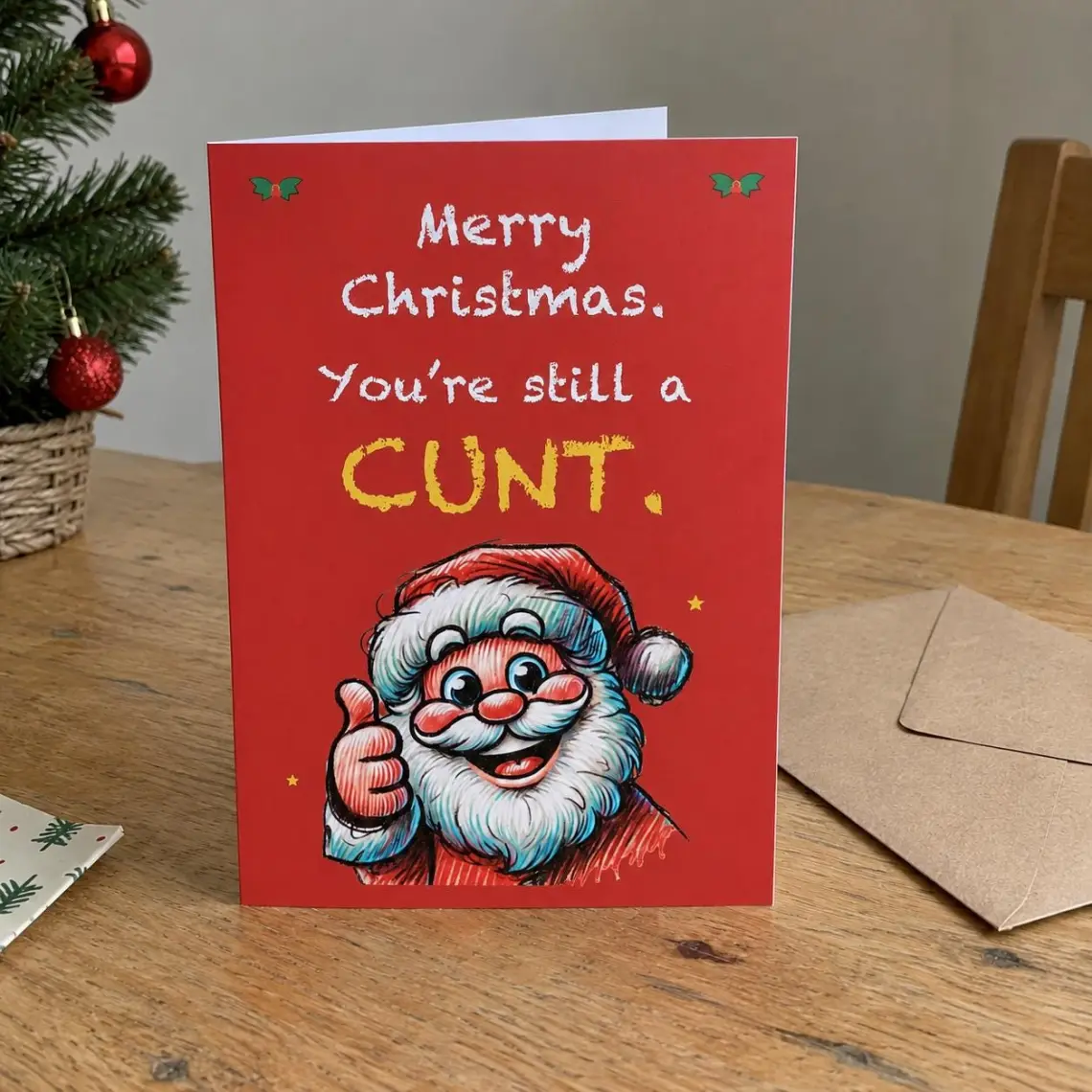 Red Christmas card with a thumbs-up Santa, reading: Merry Christmas. You're still a cunt.